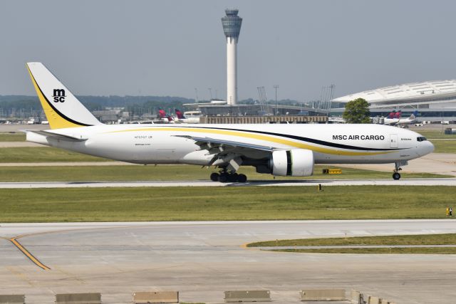 BOEING 777-200LR (N707GT) - Rolling out on runway 32 upon arrival from MEX on 06-10-23