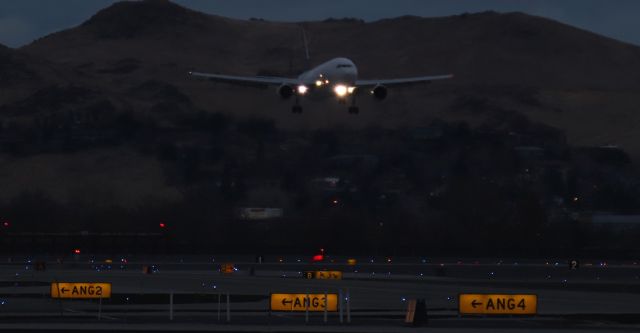 Airbus A300F4-600 — - Snapped handheld from just over a mile away, this A306 is viewed on very s/final to 17R as the early dawn light begins to illuminate the hills north of RNO.