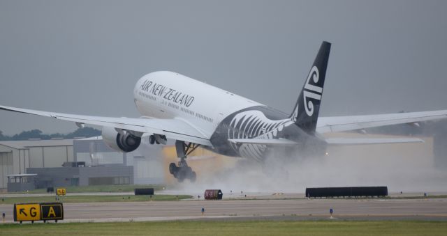 Boeing 777-200 (ZK-OKE) - Its a shame to just come out of paint to only get wet on take-off.. 