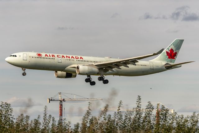 Airbus A330-300 (C-GFAJ) - 31st Oct., 2023: On short finals to rwy 24L at Montréal-Pierre Elliott Trudeau International Airport operating as flight AC 879 from Toulouse-Blagnac, France. Photo shot from Ryan Ave Spot. 