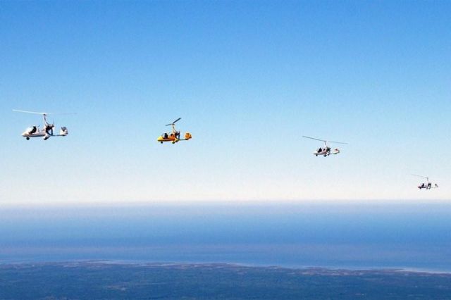 — — - Magni gyros in flight with the GOM in the background.  Scott Gaitros, Greg Gremminger, Deb Wright, Paul Salmon