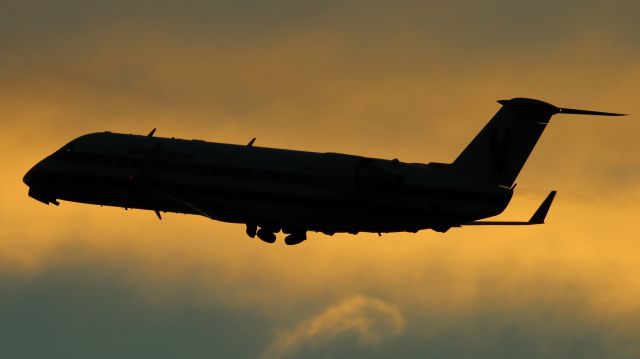 Canadair Regional Jet CRJ-200 (N862AS) - American Eagle departs Reno-Tahoe slightly afyre sunset.