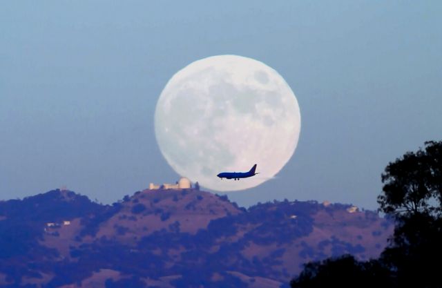 Boeing 737-700 — - Full Moonrise November 16, 2013 over Lick Observatory on Mt. Hamilton near San Jose, CA caught a Southwest Airline 737 on final approach.