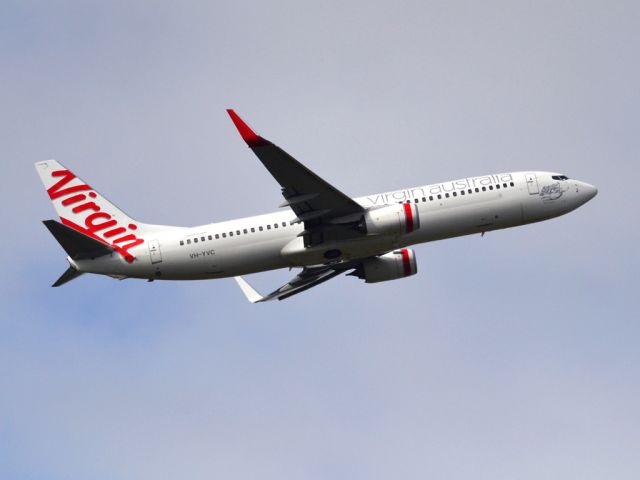 Boeing 737-800 (VH-YVC) - Getting airborne off runway 23 on a gloomy, cold winters day. Wednesday 4th July 2012.