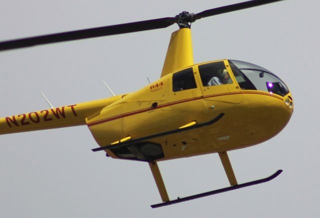 Robinson R-44 (N202WT) - Final close up of N202WT orbiting low over residential Clairemont on 07-MAR-2020 at approx 1212PST. Telephoto taken while sitting on my balcony.