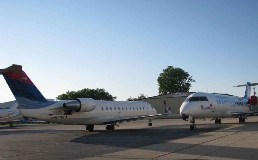 Canadair Regional Jet CRJ-100 (N416CA) - A gagel of CRJs at the Emery CRJ Maintenance facility at RFD