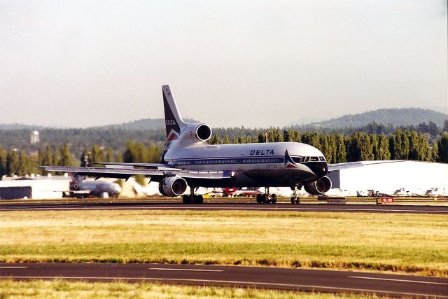 Lockheed L-1011 TriStar (N739DA) - KPDX - N739DA braking down after a long haul from ATL this jet arriving late PM in the Pacific Northwest in late summer possibly August 1989