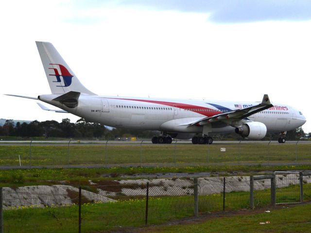 Airbus A330-300 (9M-MTC) - On taxi-way heading for take off on runway 05, for flight home to Kuala Lumpur, just before the arrival of a rain storm. Thursday 12th July 2012.