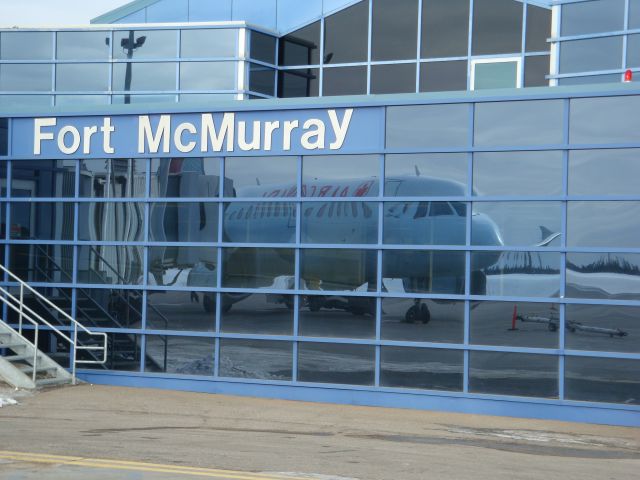 Airbus A319 (C-FZUG) - Reflection of Air Canada A319 at CYMM