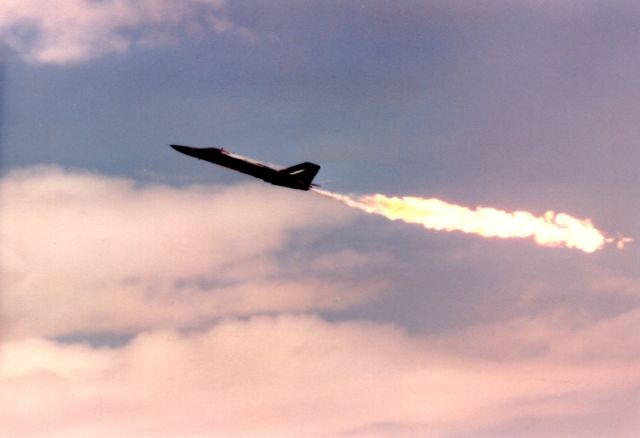 AWEF — - F-111 flyby at Edwards AFB 1986 during air show. Released fuel and hit after burner.