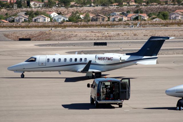 Learjet 45 (N667MC) - Taxiing to depart rwy 35L on 27-Oct-14.