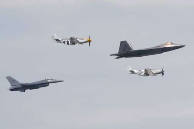 — — - USAF ACC Heritage Flight with two P-51s, an F-16 and F-22 in May 2019