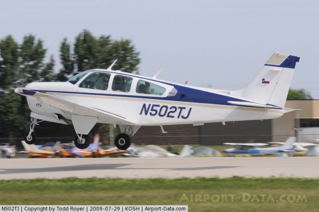 — — - Taking off at Oshkosh