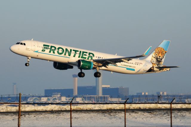 Airbus A321 (N712FR) - Early morning departure off of 22-L. 3 of 4 of ORDS control towers in this shot!