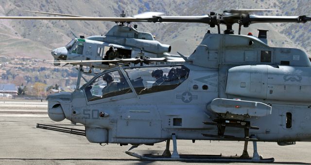 16-9254 — - USMC AH-1Z "Viper" (169254)br /Crew nickname for aircraft: "Midnight Sun" .... Visible directly beneath the "50."br /In Background: USMC UH-1Y "Venom" (169233)br /Both assigned to ....br /HMLA-369 (Marine Light Attack Helicopter Squadron 369) "Gunfighters"br /MAG 39 (Marine Aircraft Group 39)br /3rd MAW (Marine Aircraft Wing)br /MCAS Camp Pendleton, CAbr /br /Two of nine departures