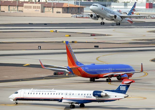 Canadair Regional Jet CRJ-900 (N246LR) - In the picture you have N246LR (ASH CRJ-900), N8622A (SWA B738) and N659AW (AA A320)