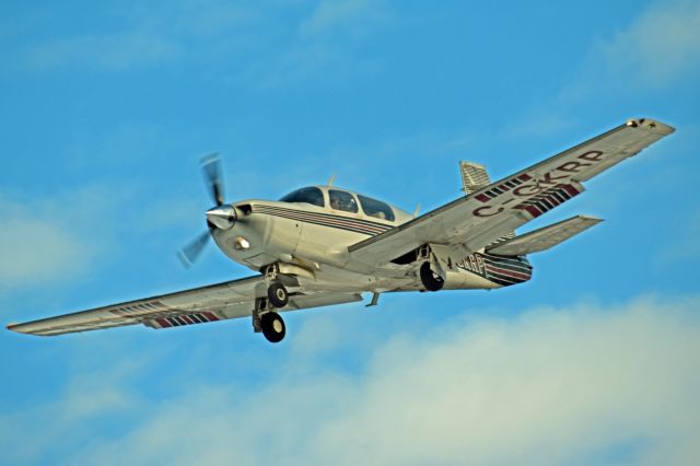 Mooney M-20 (C-GKRP) - 1986 Mooney M20K 231 (C-GKRP/25-1060) on final approach from Norman Rogers/Kingston Airport (CYGK) on Feb 7, 2022