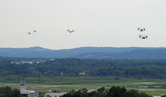 Bell V-22 Osprey — - MORRISTOWN, NEW JERSEY, USA-AUGUST 14, 2020: On a cloudy and overcast day, Marine One (one of the Sikorsky helicopters) and her four escorts, are seen after taking off from Morristown Municipal Airport en route to New York City. The Marine One detachment this time consisted of two Sikorsky helicopters and three V-22 Osprey tilt-rotor aircraft. President Trump spent the weekend at his golf club in Bedminster, New Jersey but first flew to New York City to see his ailing brother. The Ospreys probably contained staff personnel and members of the press. Photo taken from approximately one mile away.