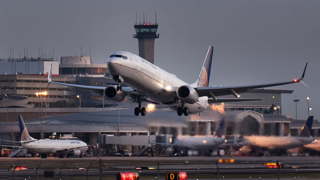 Boeing 737-900 (N68880) - Wheels up before sunrise Shot at ISO 5000