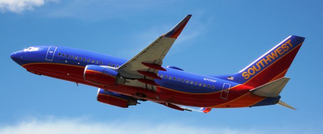 Boeing 737-700 (N7720F) - Departing from 17R.