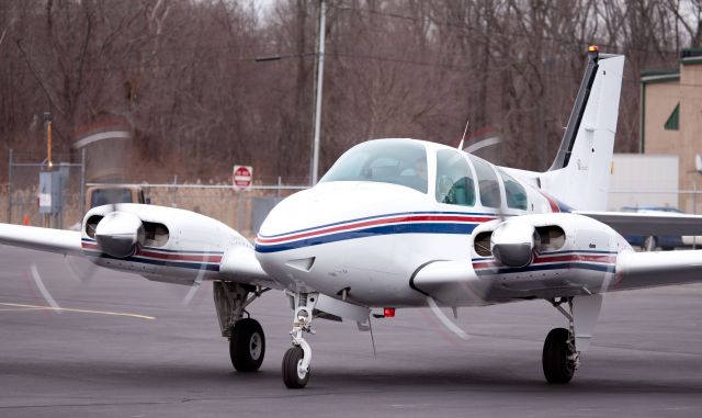 Beechcraft Baron (58) (N21VM) - At The RELIANT AIR ramp, where you find the lowest fuel price on the Danbury (KDXR)airport.