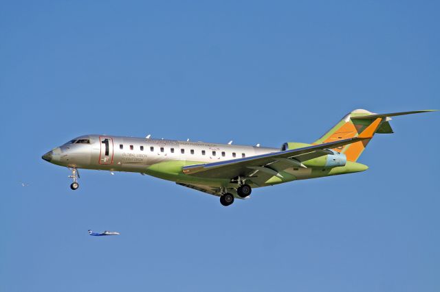 Bombardier Global Express — - Global Express, Bombardier's test bed and first Global Vision Flight Deck.  I've seen thig plane countless times and it's Dash-8 relative in the background.