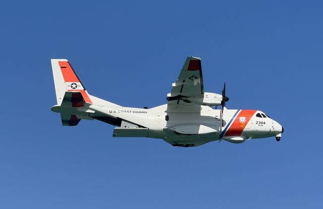 C2304 — - USCG EADS HC-144 Ocean Sentry flying over the beach near Hollywood, Florida. 