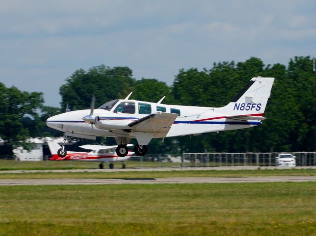 Beechcraft Baron (58) (N85FS) - Departing Runway 26