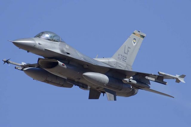 Lockheed F-16 Fighting Falcon (90-0762) - F-16C Fighting Falcon of the 310th Fighter Squadron Top Hats based at Luke AFB pulls up from a strafing run on the Goldwater Bombing Range. .