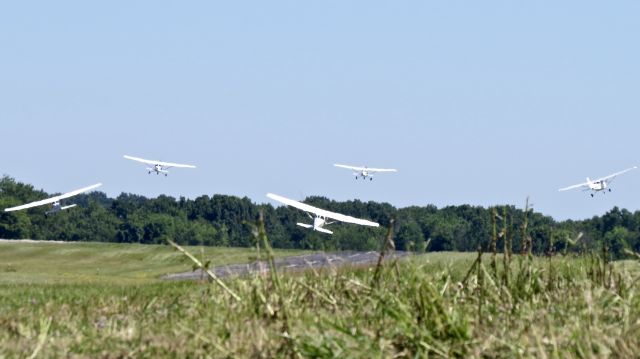 Cessna Skyhawk (N539KS) - Kent State instructors depart RWY1 for a formation flyover at a local event in Kent. 