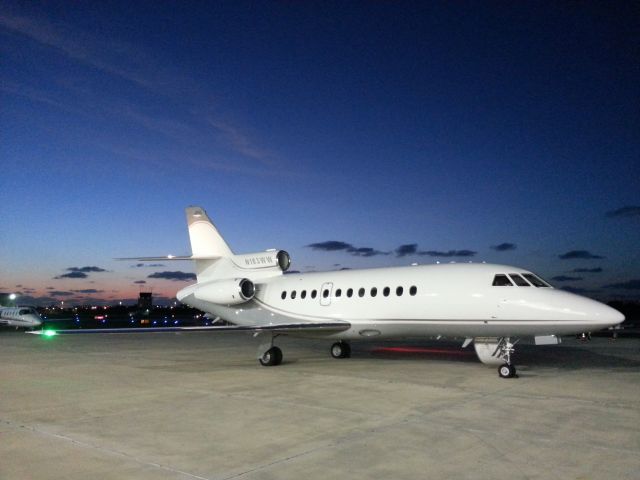 Dassault Falcon 900 (N183WW) - We just finished preflight and went inside the hangar. When I came out I saw the sunrise and thought it made a great backdrop. I took this picture with my phone.