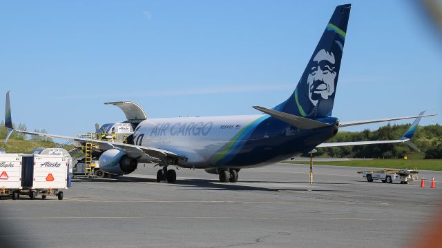 Boeing 737-700 (N584AS) - Alaska Air Cargo ASA9563/AS9563 from Anchorage (PANC/ANC) and continuing on to King Salmon (PAKN/AKN) sits at gate 1 as the second visit to ADQ of this aircraft as a freighter. Also visible: the Moon (top center)br /Photo date: 6-15-24br /Upload date: 2-6-25