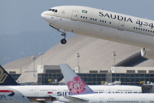 BOEING 777-300ER (HZ-AK22) - A Saudia 777-300ER begins climbing shortly after rotation in the foreground, with a new China Airlines 777-300ER, Singapore Airlines A380, and British Airways A380 all in the background at TBIT.