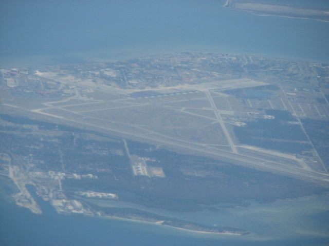 — — - Leaving from Sarasota FL on the way back to Charlotte NC.  Out the window is MacDill AFB just across Tampa Bay.