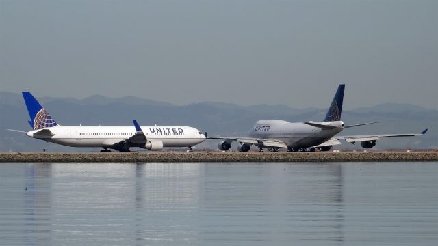 Boeing 747-400 (N104UA) - 20150306-142111.jpgbr /N104UA and N673UA are ready to leave San Francisco Intel Airport (KSFO)br /br /N104UA / Boeing 747-422 br /2015-03-06 UA857 San Francisco (SFO) Shanghai (PVG) 14:24-->Landed 18:41br /br /N673UA / Boeing 767-322(ER) br /2015-03-06 UA990 San Francisco (SFO) Paris (CDG) 14:26-->Landed 09:53