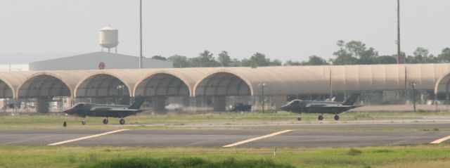 Lockheed F-35C — - F-35s taxi. I was driving north out of Destin passing Eglin AFB where they had numerous jets performing touch & gos. I pulled over and took photos of this impromptu airshow.