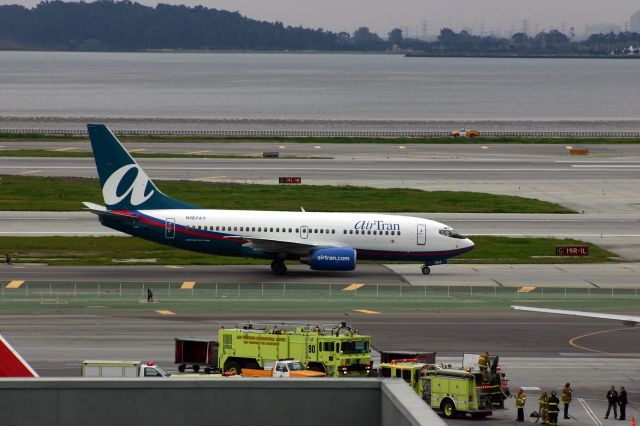 Boeing 737-700 (N167AT) - KSFO - Long gone Air Tran 737-700 on taxi to Runway 1R for departure ar SFO 2/13/2005.
