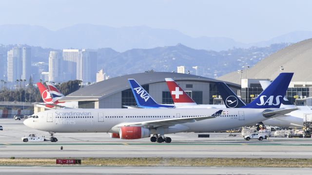 Airbus A330-300 (LN-RKR) - Getting towed to parking at LAX on taxiway Bravo