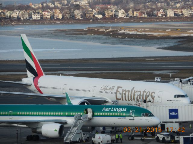 BOEING 777-300 (A6-ECE) - Note the incredible size difference of a Boeing 777-300 over the Aer Lingus 757.