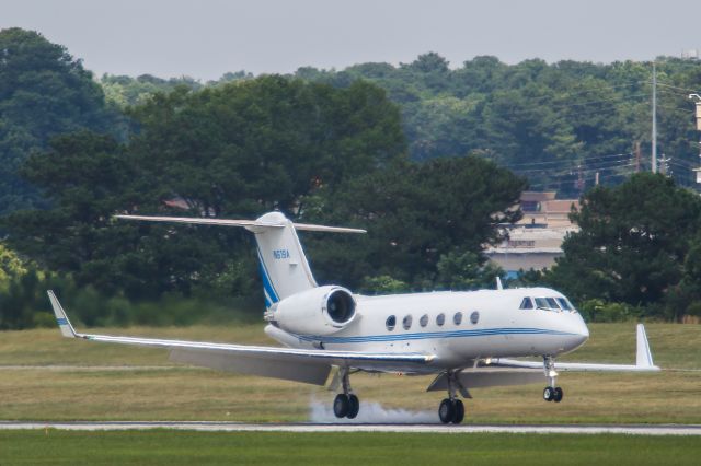 Gulfstream Aerospace Gulfstream IV (N619A) - G-IV Gulfstream N619A landing on left wheels at KPDK in Atlanta Georgia. Questions about this photo can be sent to Info@FlewShots.com