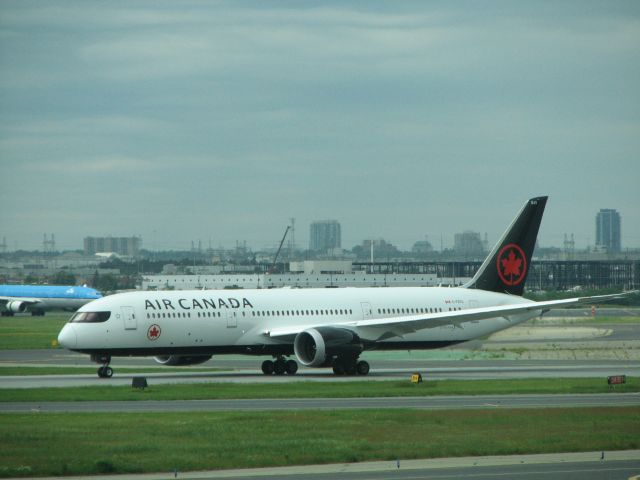 Boeing 787-9 Dreamliner (C-FRTG) - Photo taken at one of the gate areas on a very gray day. 