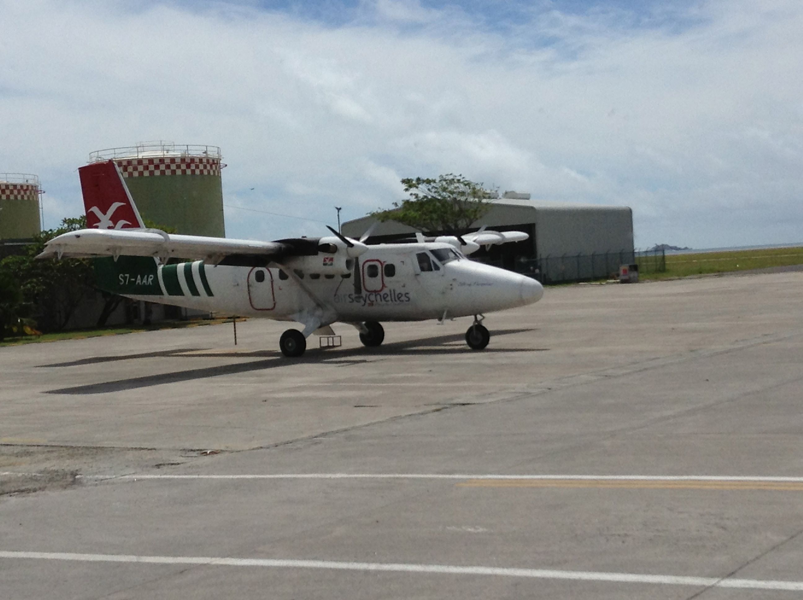 — — - Air Seychelles inter island service Twin Otter in her normal livery the green, red and white.  Sits at the International Airport on Mahe island at the domestic side of the field.