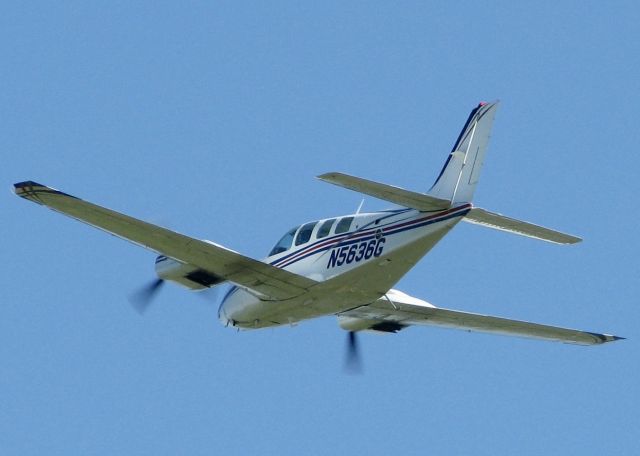 Beechcraft Baron (58) (N5636G) - At Downtown Shreveport.