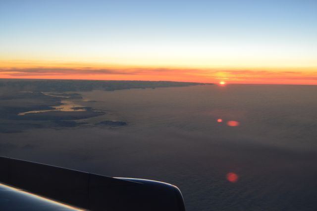 Boeing 747-400 — - Sunrise over East Coast of Greenland. Taken on United 58, SFO-FRA, July 2, 2016