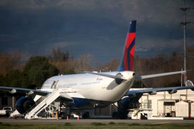 Airbus A330-300 (N809NW) - Aircraft formerly,Operated by Northwest Airlines. Seattle Seahawks Charter, DL # 8870, Awaits the team, Following their win over the San Francisco 49ers. 01-01-17