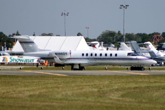 Learjet 45 (N100GY) - Lining up to depart rwy 07 on 22-Oct-14.