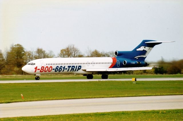 BOEING 727-200 (C-GKKF) - This is a photo taken back in the 1990s,Greyhound Air,I thought i would share with you avaiation enthusiast on this site,picture was scanned from a slide,not the best quality,Taken at Hamilton Intl Airport,1990s.