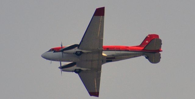 Douglas DC-3 — - Douglas DC-3 overflying Garden City Beach Pier, SC on 10/2/2018.