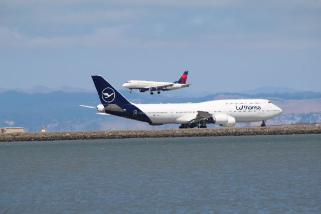 BOEING 747-8 (D-ABYA) - View in full for highest quality.br /Lufthansa 747-830 and Delta E175. Heat blur had kicked in.