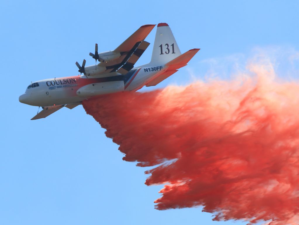 Lockheed C-130 Hercules (N130FF) - Coulsons next generation airtanker  C-130H/Q Tanker 131, RADS-XL 3,500 USG Tank System at a Flow Rate 1,600 gal/sec, with GPS Based Drop Start/Stop... makes retardant drop on June Fire, June Lake CA. 9-17-14.